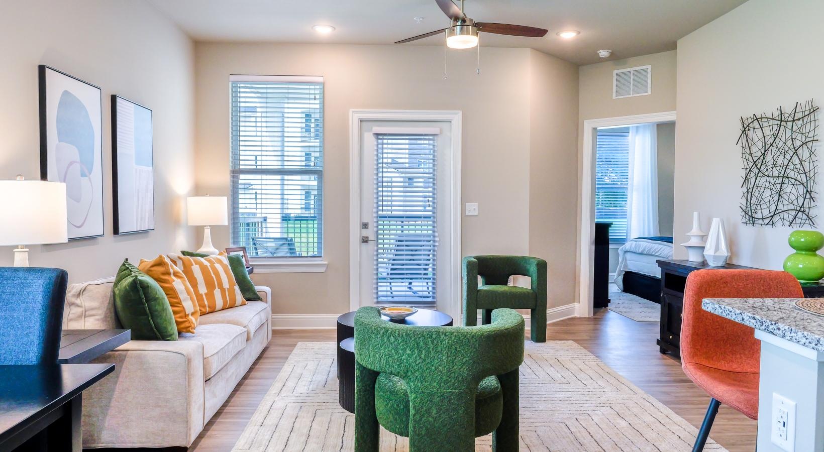 Wide open living areas perfect for entertaining a living room with a couch and a table and large window