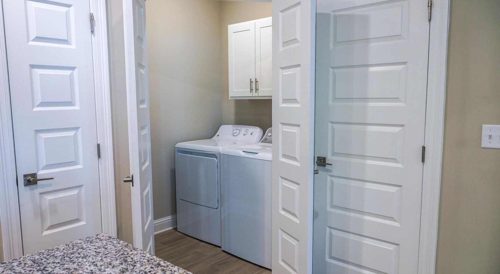 Laundry has never been easier a laundry room with a washer and dryer