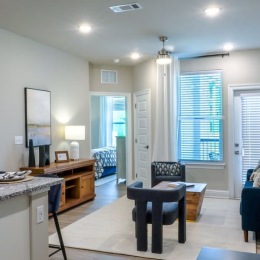 Cozy corners and endless possibilities! a living room with chairs and large windows