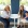 two women sitting at a table posing
