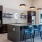 a common area with a coffee bar and a table and chairs