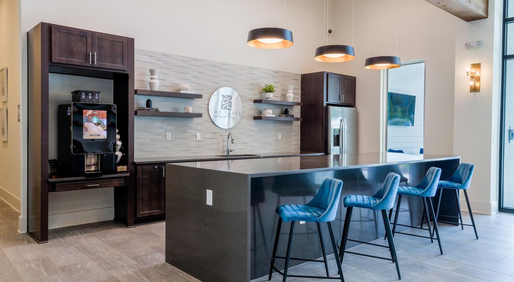 Take advantage of all The Flats at East Bay has to offer a common area with a coffee bar and a table and chairs