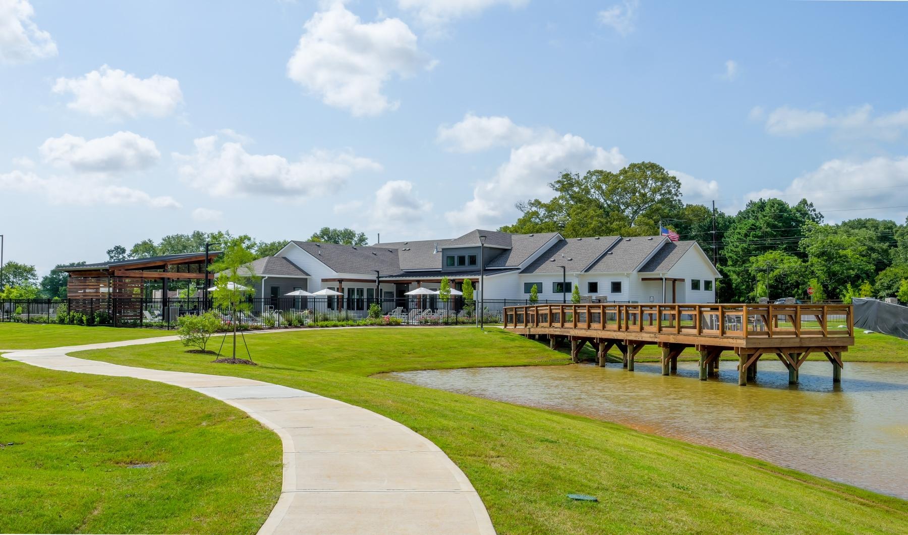 The essence of exceptional living a building with a pond in front