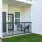 a patio with a table and chairs