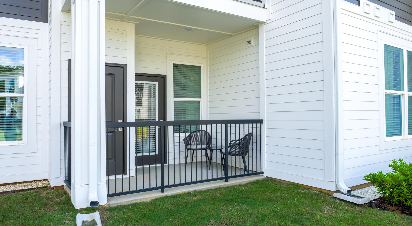 Spacious balconies a patio with a table and chairs