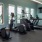 a gym with exercise equipment and windows