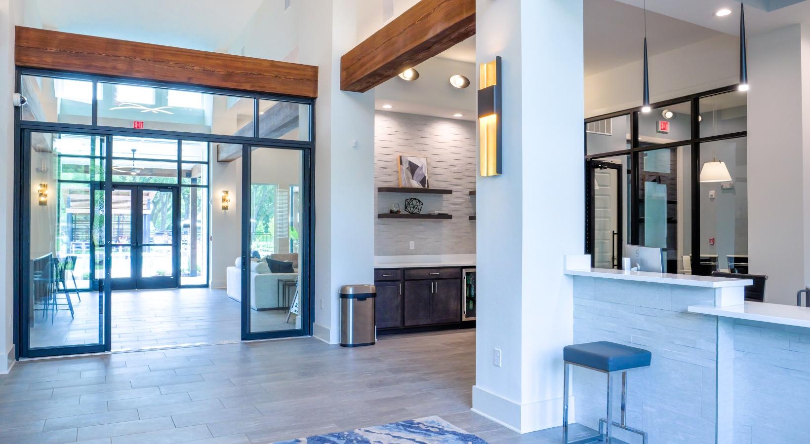 Settle into comfort at The Flats at East Bay a lobby with a large glass door
