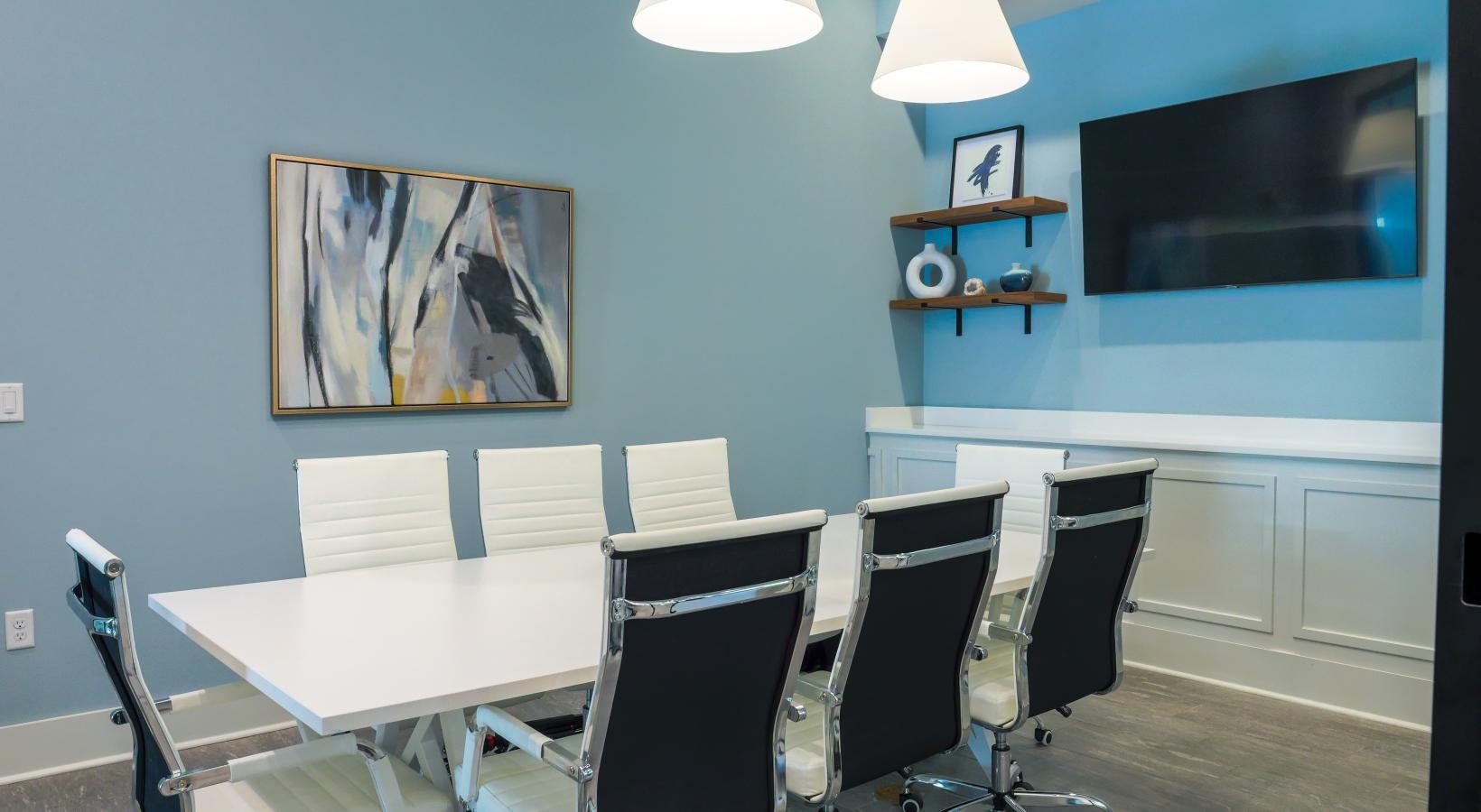 Enjoy our resident-only features a work room with a table and chairs