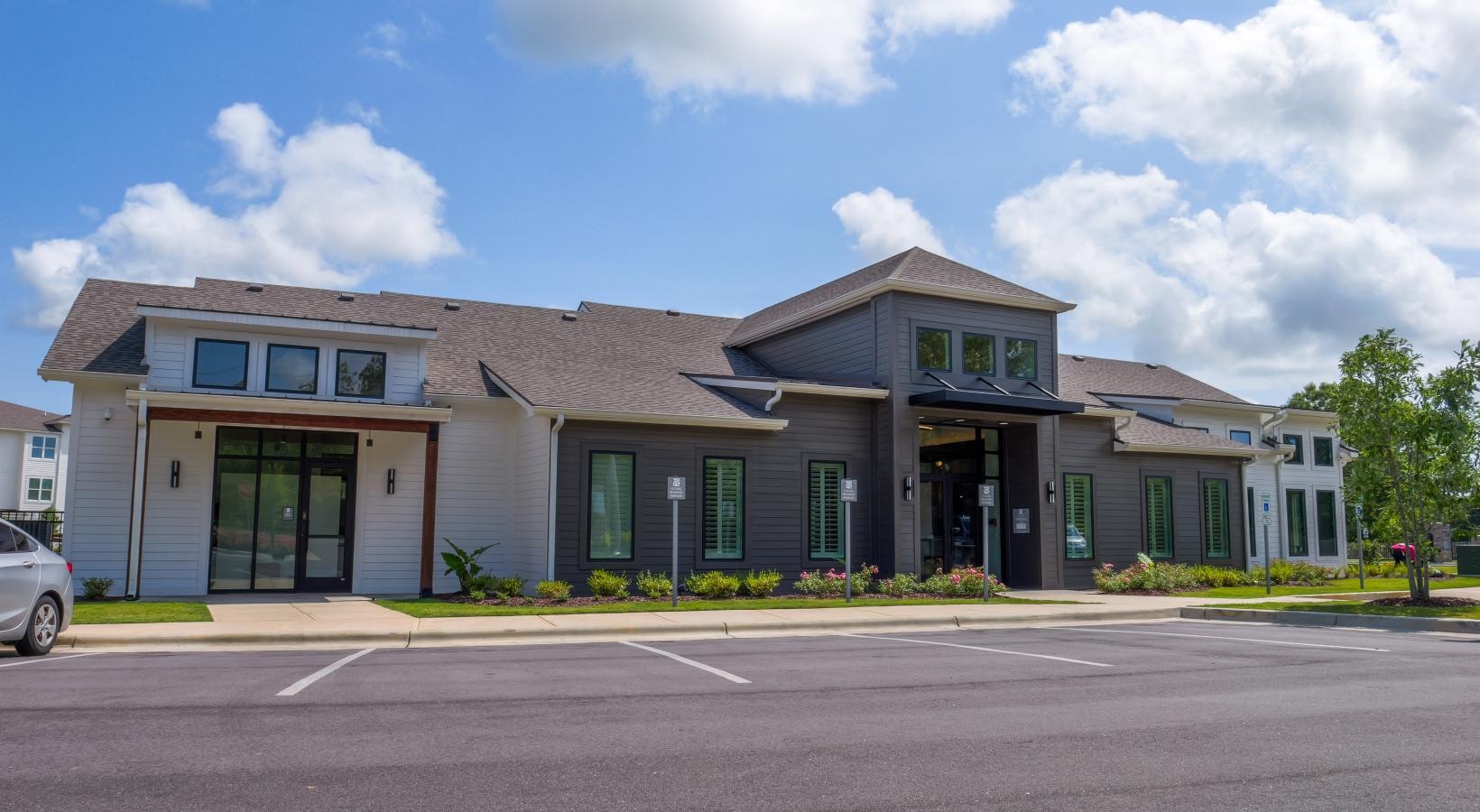 The essence of exceptional living a large building with a parking lot