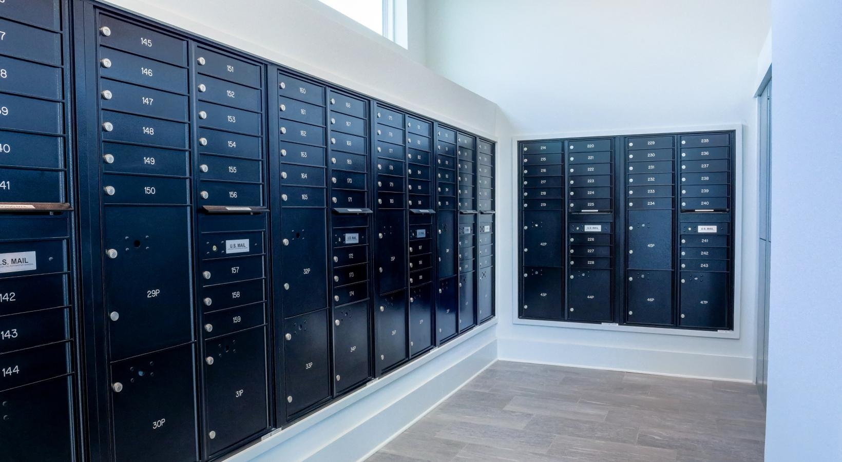 Find your perfect fit at The Flats at East Bay a room with many mail compartments