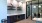 a common room with a glass door