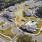aerial view of a large building and a pond