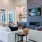 a lounge room with a fireplace couches and a tv