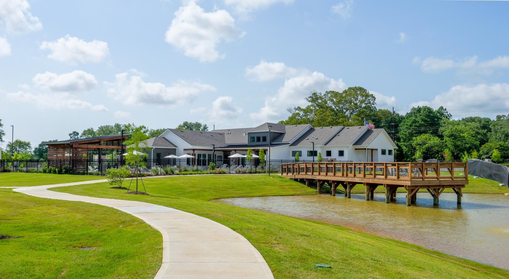 The essence of exceptional living a building with a pond in front